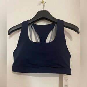 Fabletics Kessler/Boost Medium Impact Sports Bra II Color: Deep Navy/Raincloud